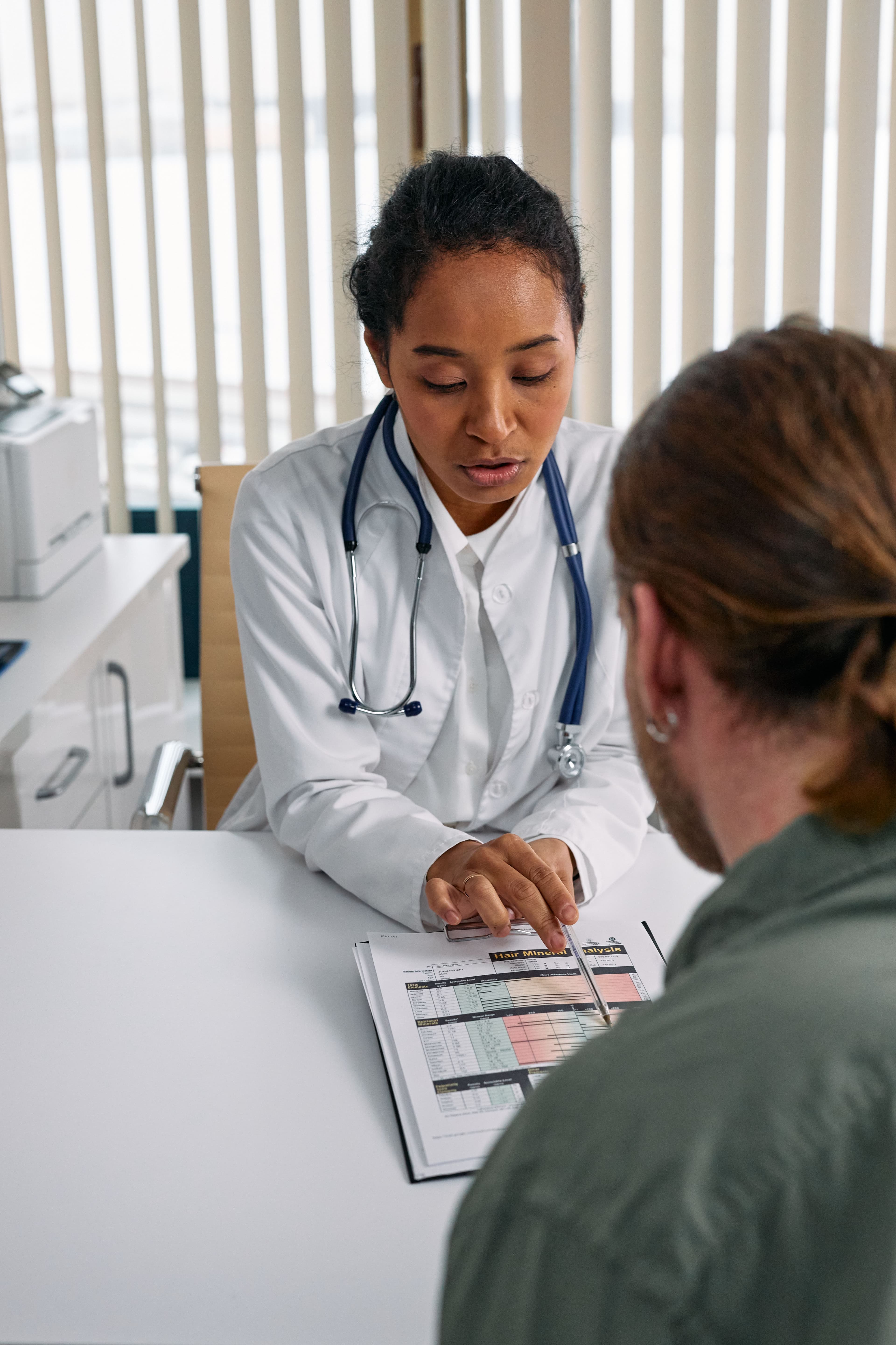 Clinician reviewing a chart with a patient